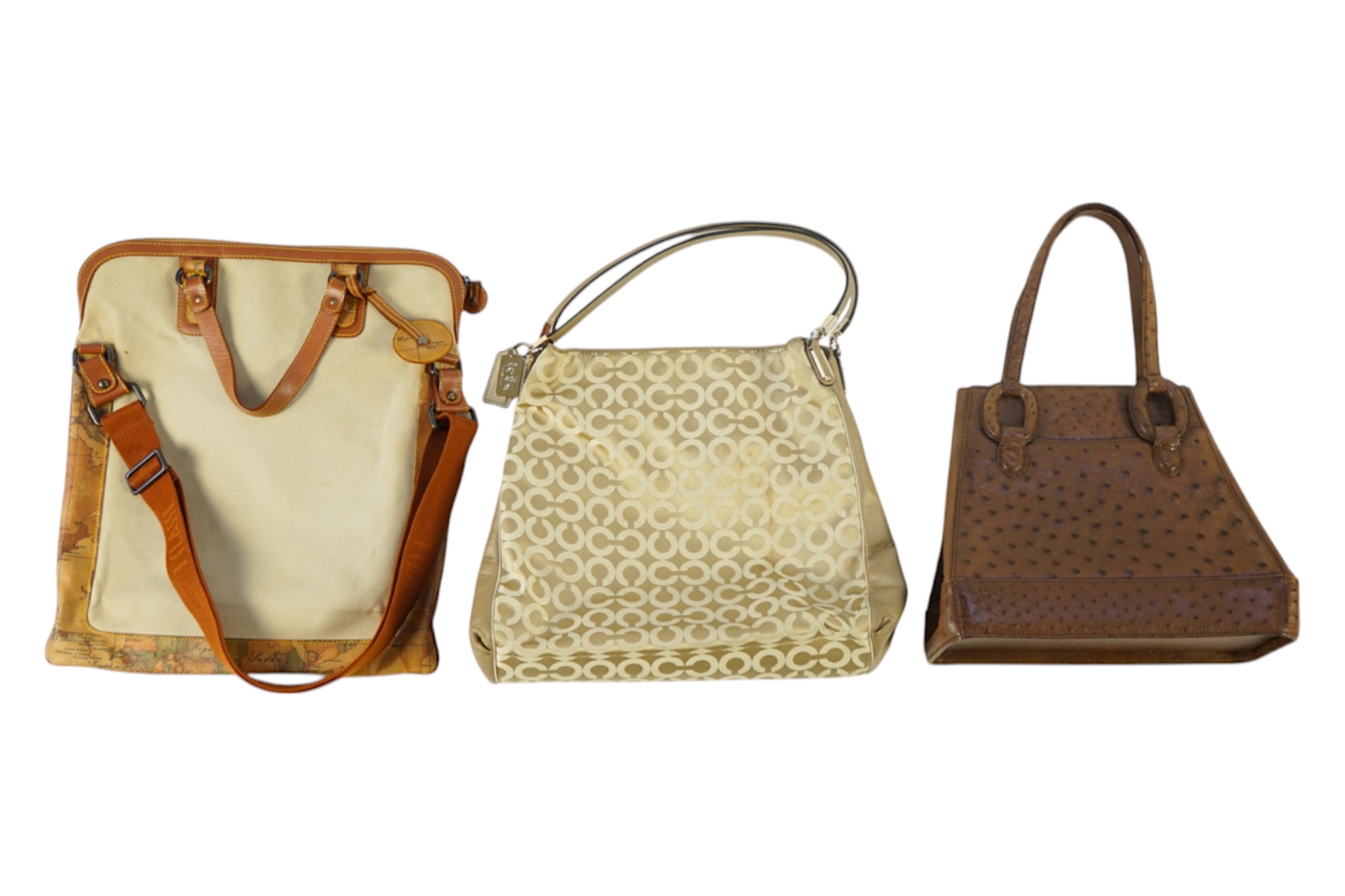 Three handbags, including Tilasse Alviero Martini canvas and leather tote, a monogram Coach tote with dust bag and a Kristar Croco brown ostrich effect leather shoulder bag